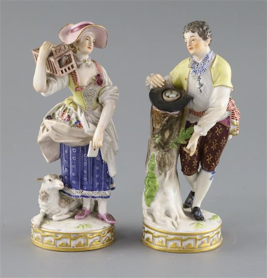 Two Meissen figures of a boy with a bird nest and girl with a bird cage, late 19th century, H. 18cm, minor losses